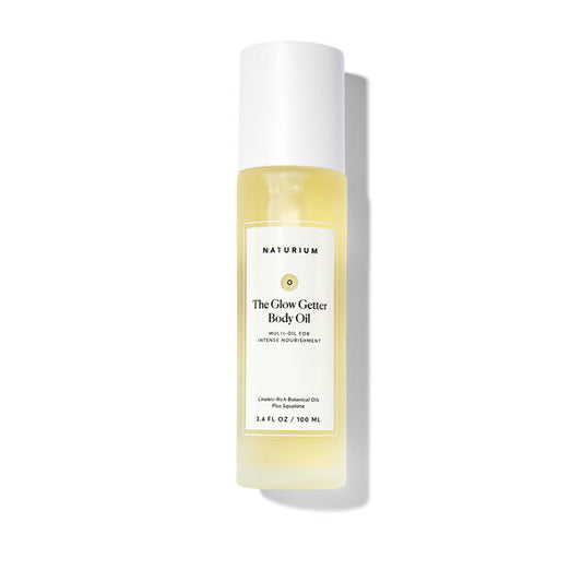 Bottle of Naturium The Glow Getter Body Oil on a white background