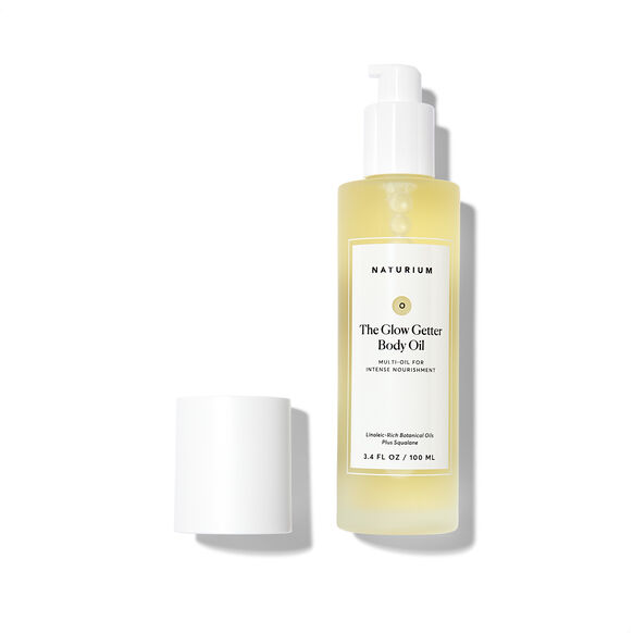 Naturium The Glow Getter Body Oil bottle on a white background