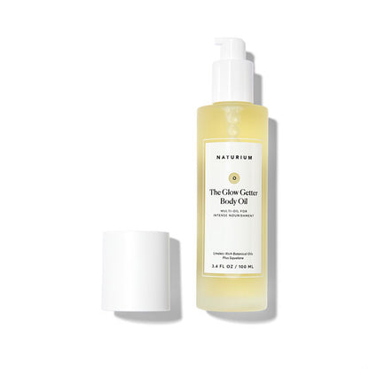 Naturium The Glow Getter Body Oil bottle on a white background