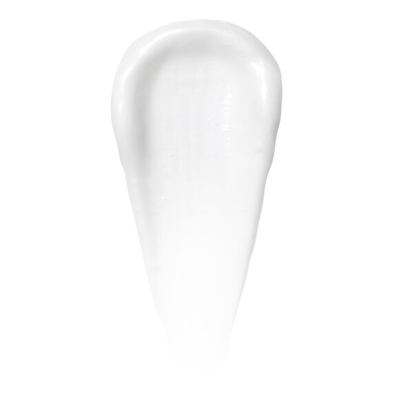 A white, creamy oval swatch of NATURIUM The Smoother Glycolic Acid Body Lotion by Naturium is spread on a plain background, showcasing the texture of this exfoliating skincare product in its 234ml size.