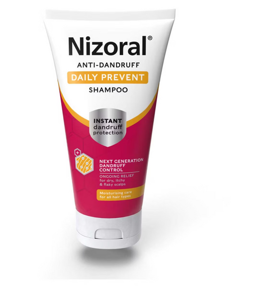 A tube of Nizoral Anti-Dandruff Daily Prevent Shampoo 200ml with a white cap features red and white packaging highlighting instant dandruff control and moisturizing care for all hair types, featuring Crinipan® PMC Green for effective protection.