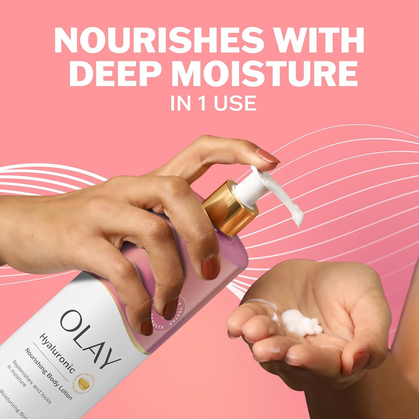 A person pumps OLAY Nourishing & Hydrating Body Lotion with Hyaluronic Acid onto their hand; text above reads “Nourishes with Deep Moisture in 1 Use” on a pink wavy background.