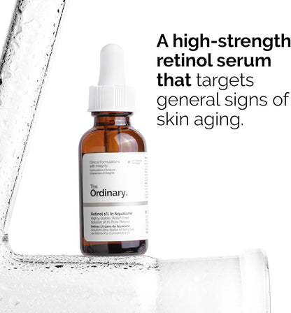 A bottle of The Ordinary Retinol 1% In Squalane 30ml sits against a textured transparent background. Text states: The Ordinarys potent retinol serum in squalane targets signs of aging.