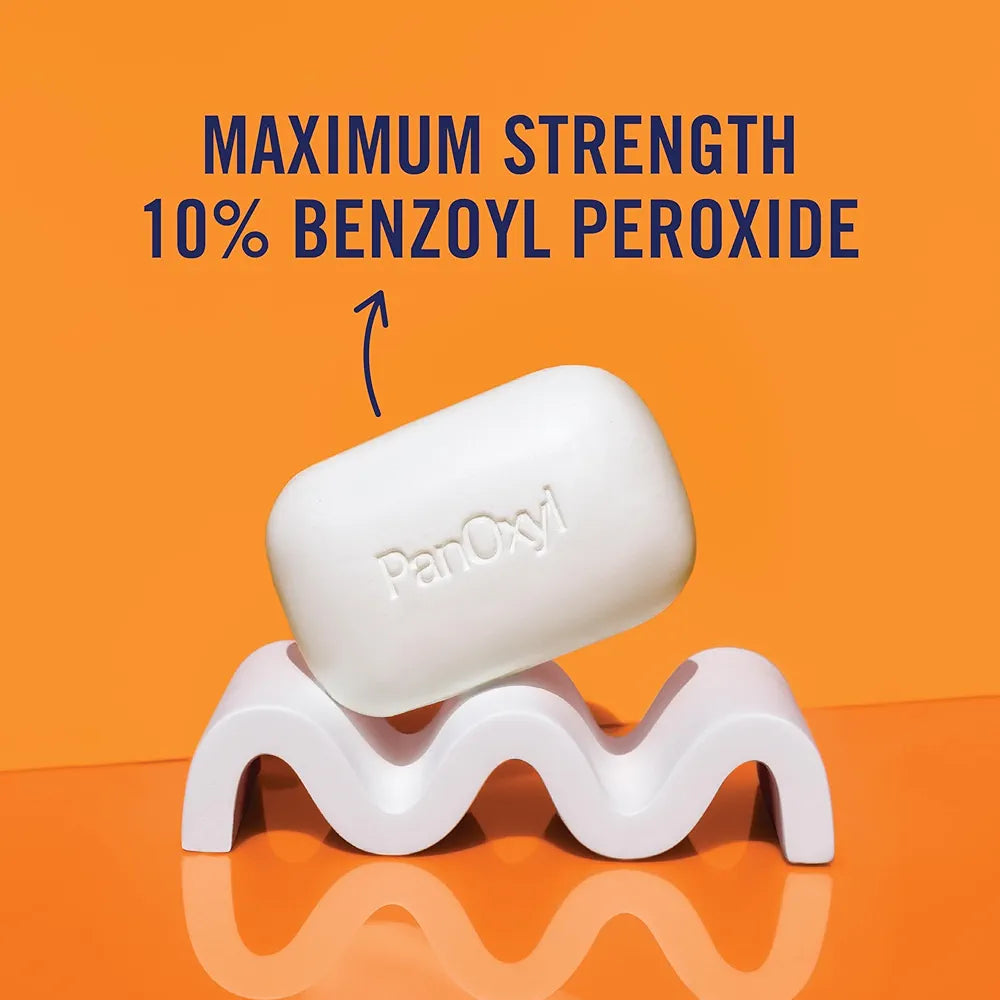 Bar of soap with 'PerOxy' branding on an orange background, labeled as maximum strength 10% benzoyl peroxide.