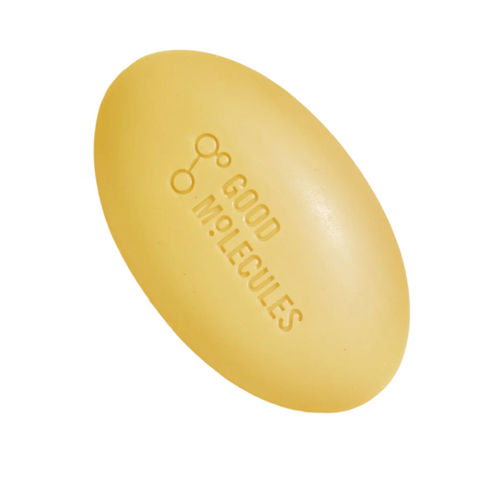The Good Molecules Hydrate & Cleanse Bar, an oval yellow soap weighing 89g, features GOOD MOLECULES and a molecular design on its surface. Designed for sensitive skin, it is shown against a white background highlighting its soothing and moisturizing properties.