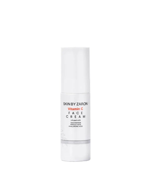 White skincare bottle labeled 'Skin by Zaron' on a white background