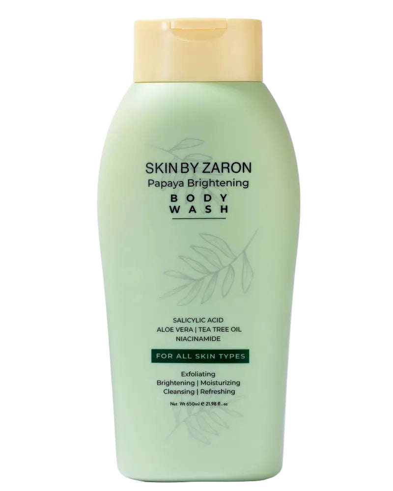 Green bottle of Skin by Zaron Papaya Brightening Body Wash on a white background