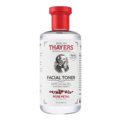 A bottle of THAYERS Facial Toner - Witch Hazel Aloe Vera Formula - Rose Petal with a red cap. The label features Since 1847 Thayers Natural Remedies, Alcohol-Free, and an illustration of a man.