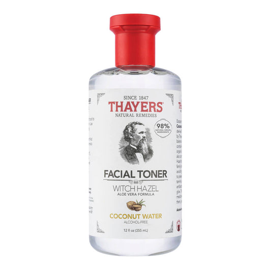 The THAYERS Facial Toner with Witch Hazel Aloe Vera Formula in Coconut Water (355ml) features a clear bottle with a red cap, 98% Natural Origin Ingredients, and an illustration of a bearded man on the label. Its alcohol-free.
