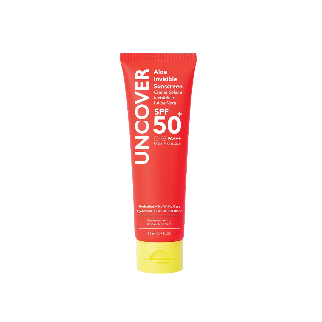 Red sunscreen tube labeled 'Uncover' with SPF 50 on a white background