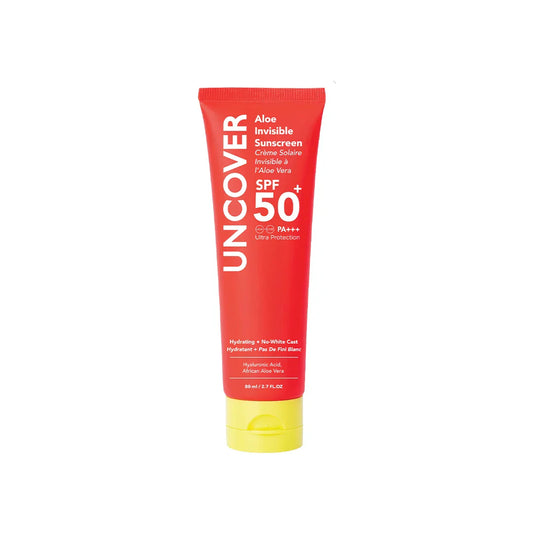 Red sunscreen tube labeled 'Uncover' with SPF 50 on a white background