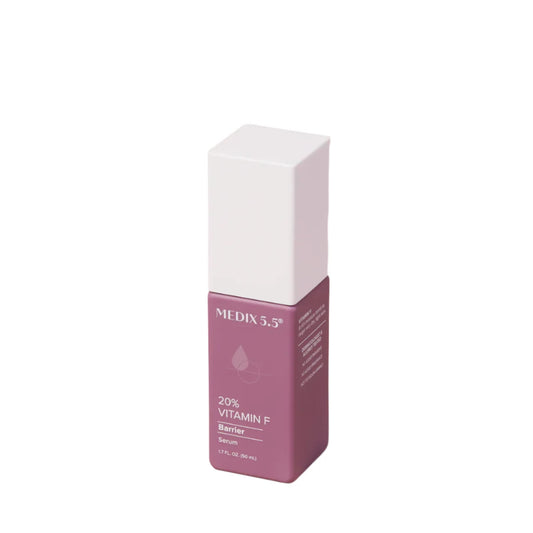 A rectangular bottle featuring a white square cap and pink body, labeled Medix 5.5, 20% Vitamin F Skin Barrier Serum, 1.75 oz (50ml).