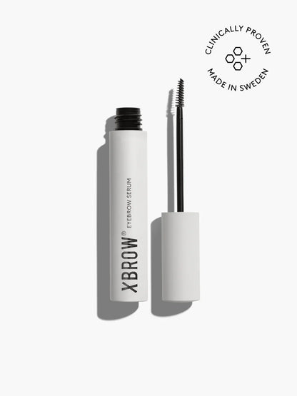 Xbrow eyebrow serum with applicator on a white background