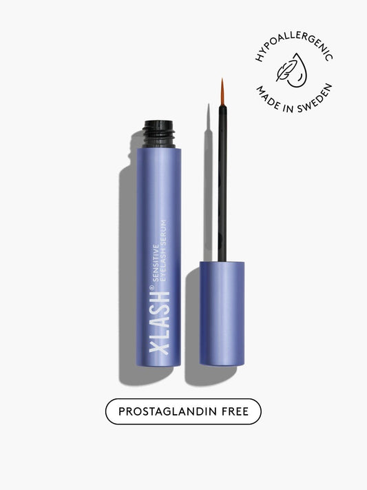 Blue eyelash serum with applicator on a white background, featuring 'Hypoallergenic' and 'Made in Sweden' labels.