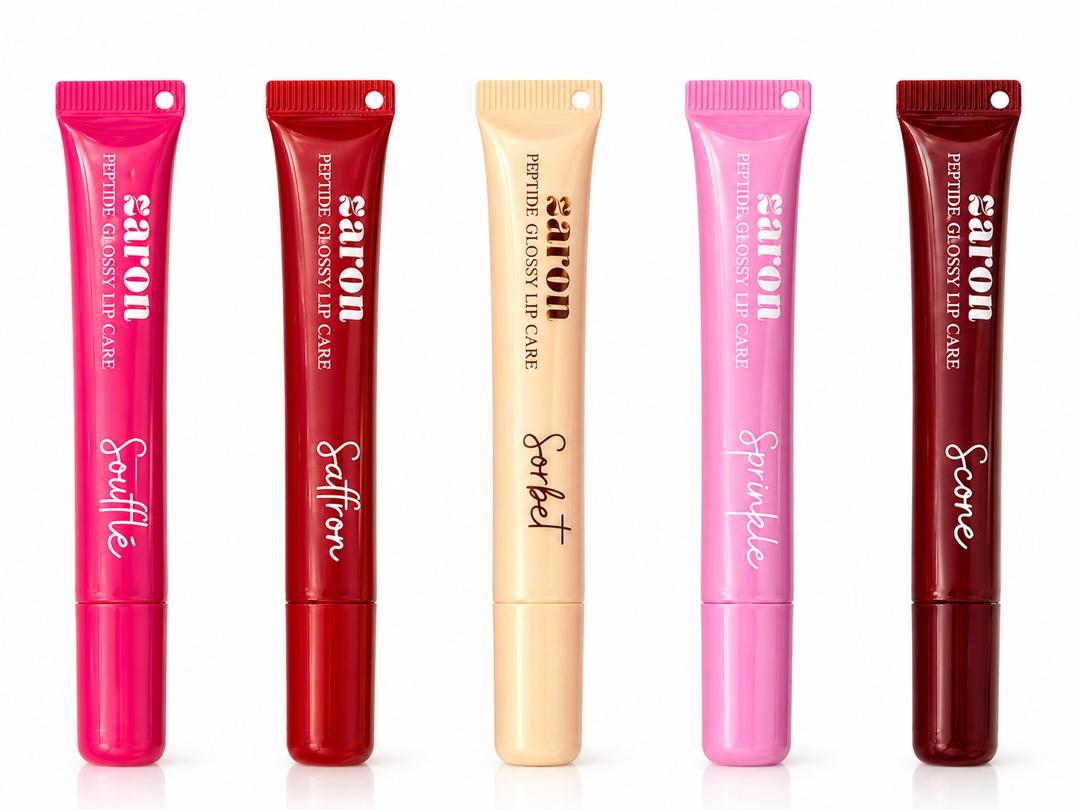 Five  gloss lip care tubes in assorted vibrant colors (pink, red, beige, light pink, and dark red) lined up side-by-side on a white background.