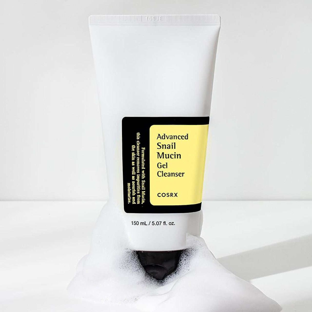 The COSRX Advanced Snail Mucin Gel Cleanser 50ml features a sleek white design with a black label and yellow accents. This gentle cleanser comes in an inverted tube providing a moisture seal for your skin.