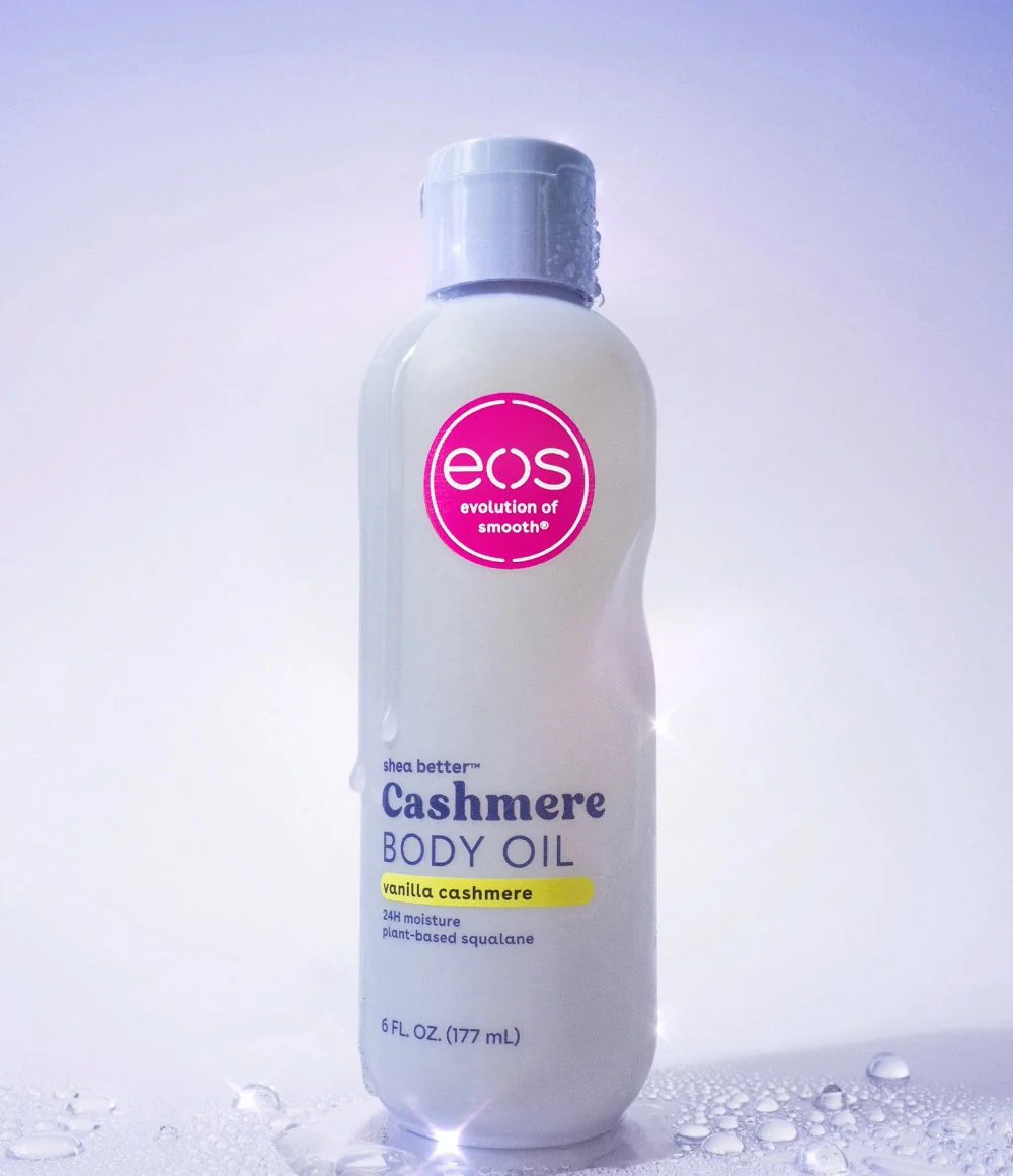 EOS Cashmere Body Oil bottle on a light purple background