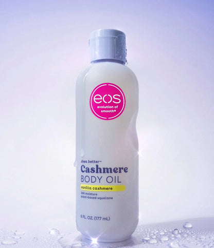 EOS Cashmere Body Oil bottle on a light purple background