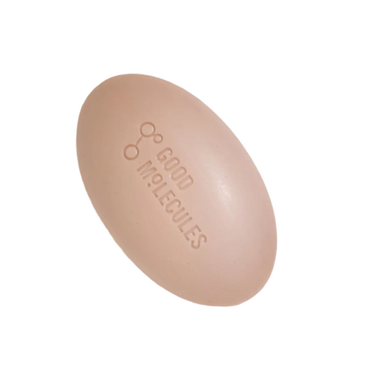 The oval-shaped Good Molecules Clarify & Cleanse Bar, featuring GOOD MOLECULES engraved on its beige surface, is infused with tea tree oil. Its positioned against a white background, perfect for a refreshing cleanse.