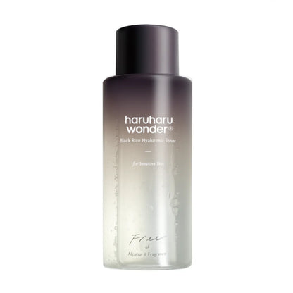 The Haruharu WONDER Black Rice Hyaluronic Toner (150ml) features Ultra Deep Technology. Its cylindrical bottle has a gradient gray-to-clear design and white text, indicating its suitable for sensitive skin, free from alcohol and fragrance, with a hyaluronic acid formula.