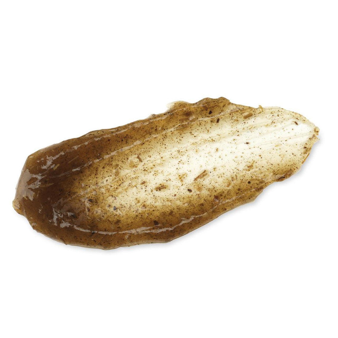 A smear of IM FROMs Mugwort Mask, with visible exfoliating particles and a creamy, slightly gritty texture, rests on a white background. Perfect for sensitive skin, this Korean vegan wash-off mask offers effective exfoliation.