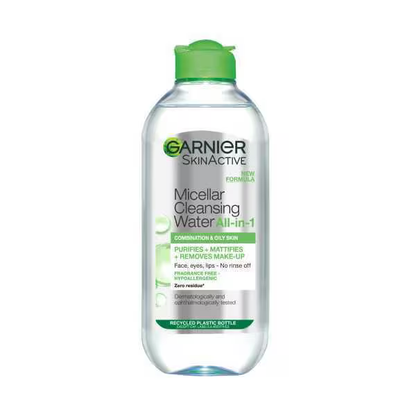 Garnier Micellar Cleansing Water, Makeup Remover for Combination & Oily Skin, is a facial cleanser and makeup remover. The clear bottle with a green cap displays product details and usage instructions on its label.