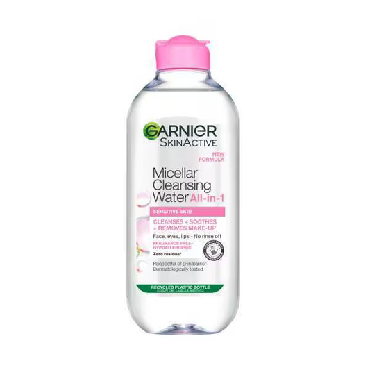 The Garnier Micellar Cleansing Water, Makeup Remover for Sensitive Skin, in a clear 400 ml bottle with a pink cap, gently removes makeup, cleanses, and soothes without rinsing. It respects skin pH and is dermatologically tested.