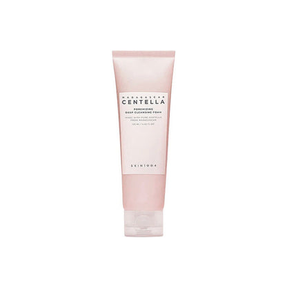 A pink tube of SKIN1004 Madagascar Centella Poremizing Deep Cleansing Foam, enriched with Himalayan Pink salt, stands against a white background, featuring minimalist packaging with the product name and details elegantly displayed in black text.