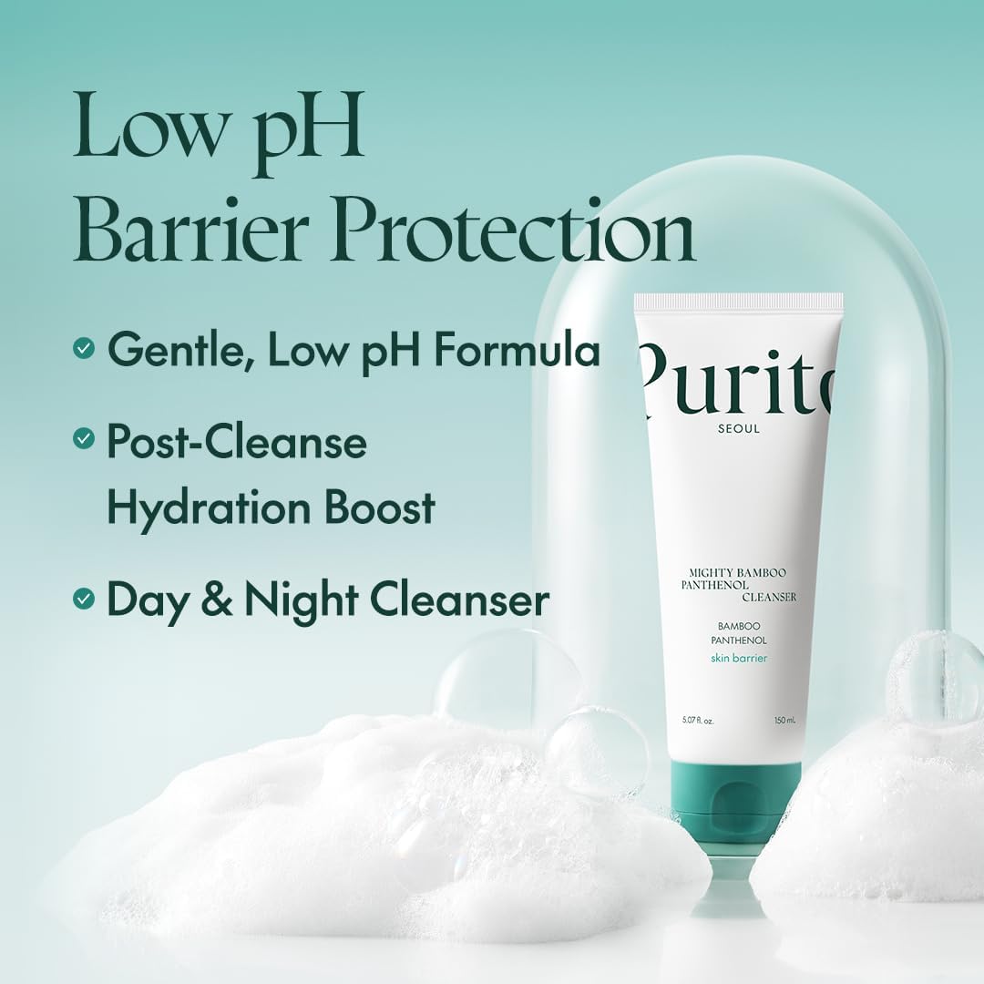 A Purito SEOUL bottle labeled Purito Seoul Mighty Bamboo Panthenol Cleanser stands against a pastel green backdrop with white foam, highlighting features: gentle bamboo extract cleanser, low pH, panthenol for post-cleanse hydration, suitable for both day and night use.