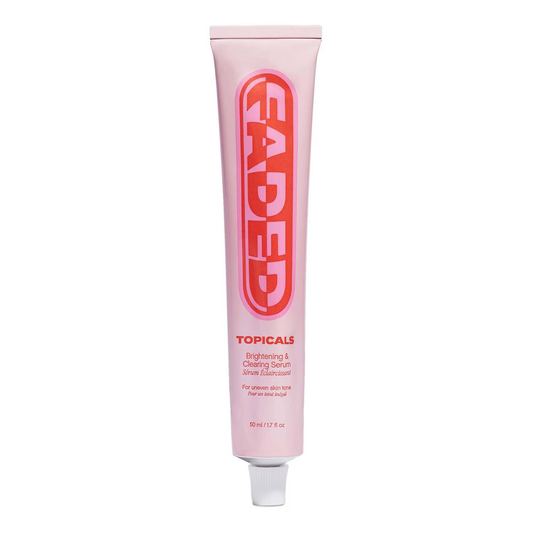 A pink tube of Topicals Faded Brightening and Clearing Serum by TOPICALS, ideal for sensitive skin, with bold red lettering highlighting its dark spot targeting formula, topped with a sleek white cap.