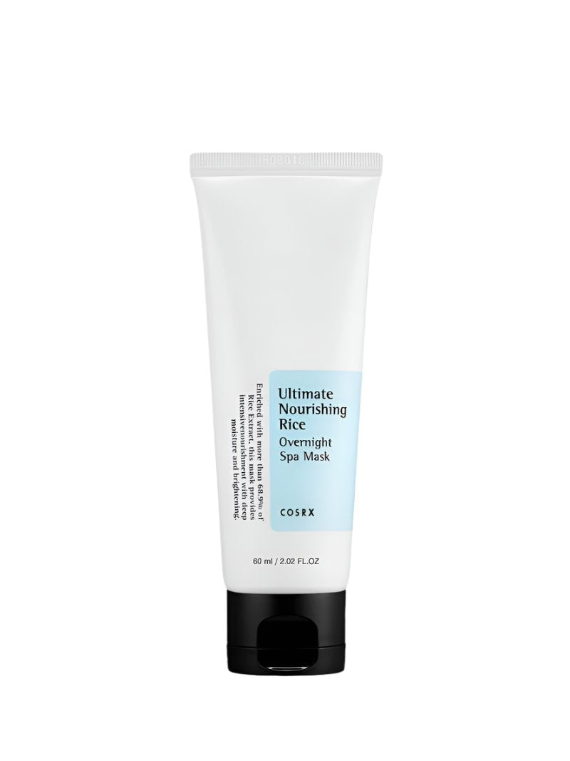 The COSRX Ultimate Nourishing Rice Overnight Spa Mask (60ml) has a minimalist white tube with a light blue label. Enriched with rice extract, this mask provides moisturizing and brightening effects for radiant skin by morning.