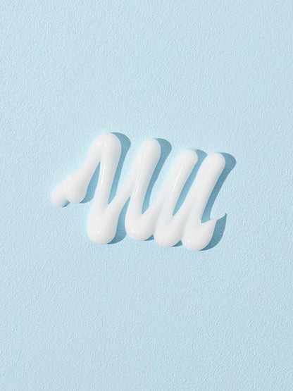 On a light blue background, the COSRX Ultimate Nourishing Rice Overnight Spa Mask features moisturising rice extract with white cream in a zigzag pattern for a truly brightening effect.